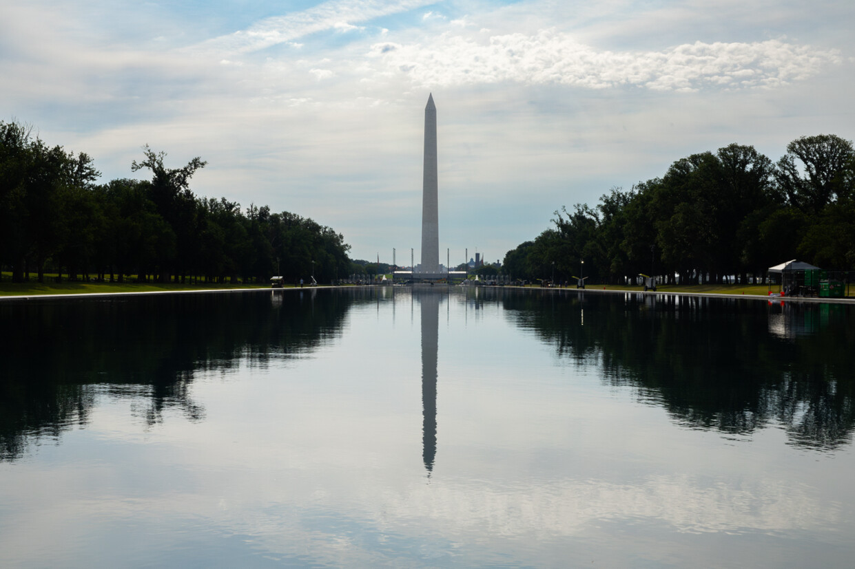 The Washington Monument is reflected across the Lincoln Memorial Reflecting Pool on the National Mall in Washington, D.C. on 07/06/2026.